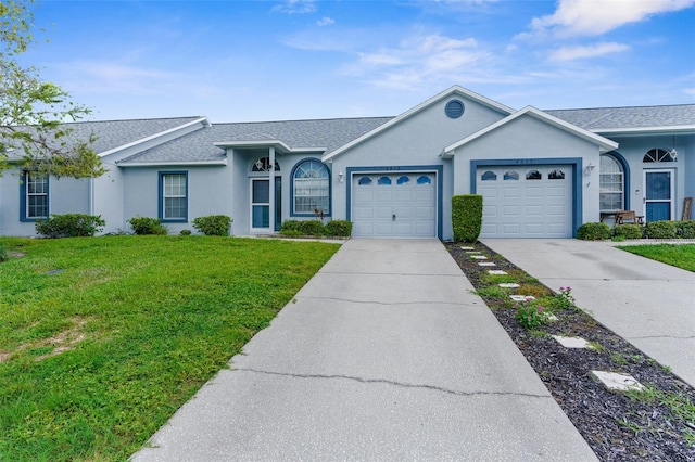 single story home with a garage and a front yard