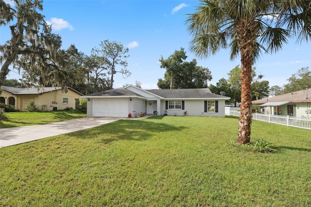 single story home featuring a garage and a front lawn