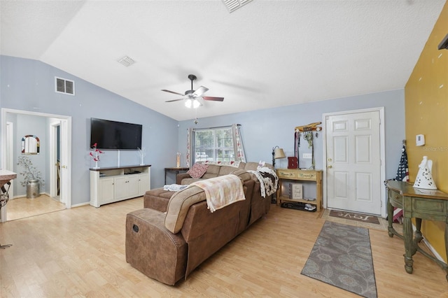 bedroom with lofted ceiling, ceiling fan, and light wood-type flooring