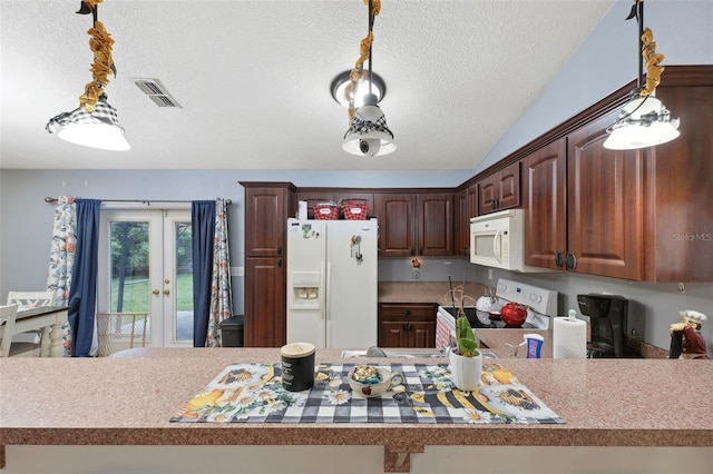 kitchen with kitchen peninsula, white appliances, vaulted ceiling, and a textured ceiling