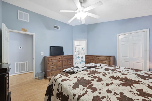 bedroom featuring light hardwood / wood-style floors, a closet, and ceiling fan