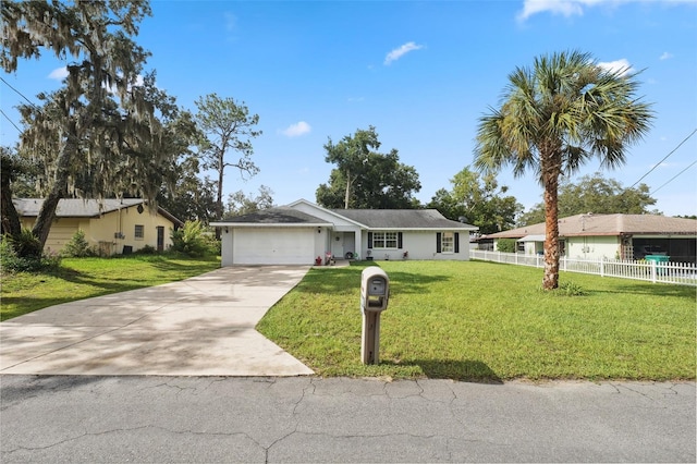 single story home featuring a garage and a front yard