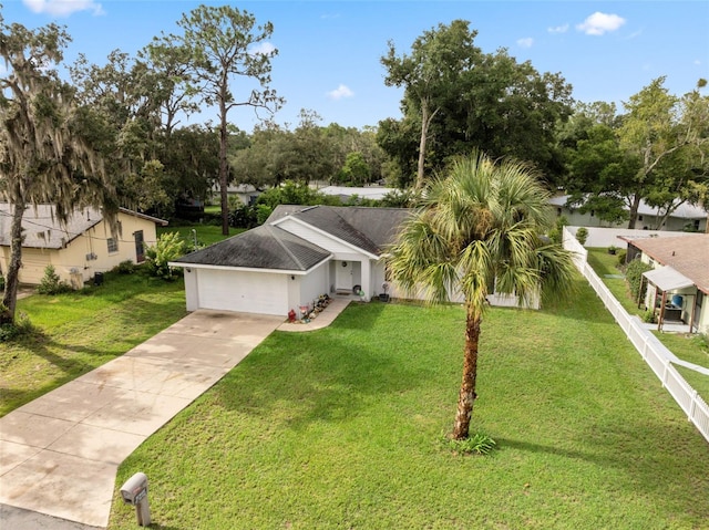 view of front of home featuring a garage and a front lawn