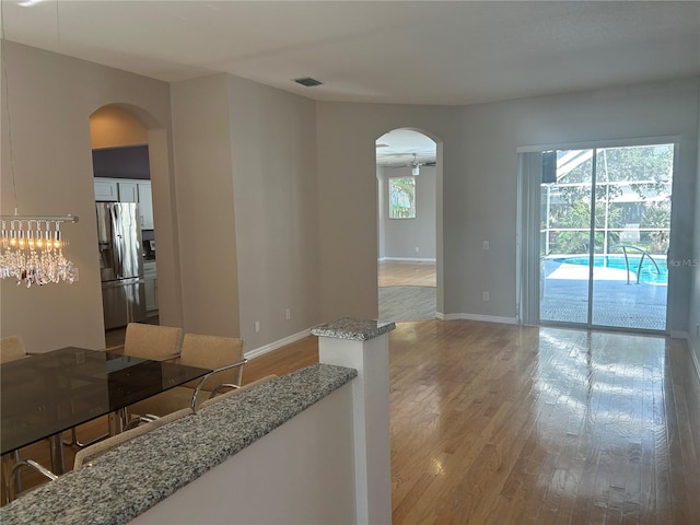 interior space featuring a notable chandelier and light hardwood / wood-style floors