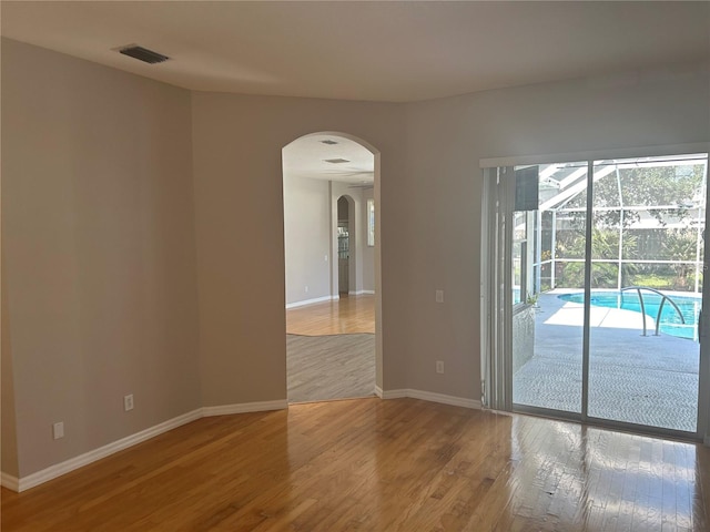 empty room with wood-type flooring