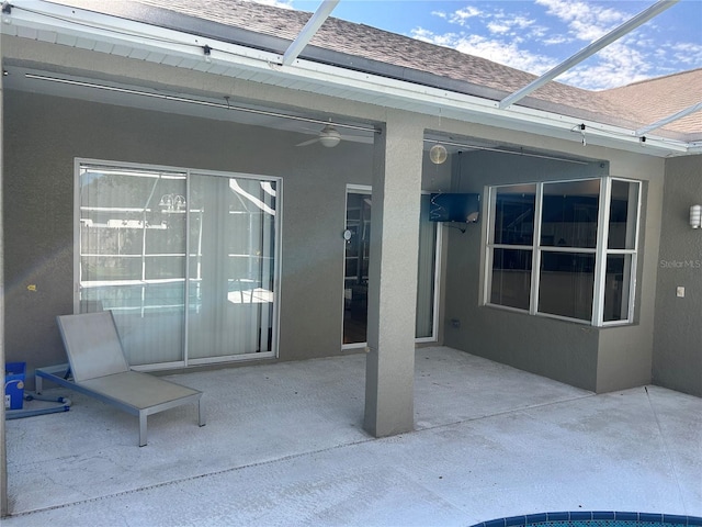 view of patio with a lanai and ceiling fan