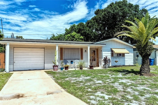 single story home featuring a garage and a front yard