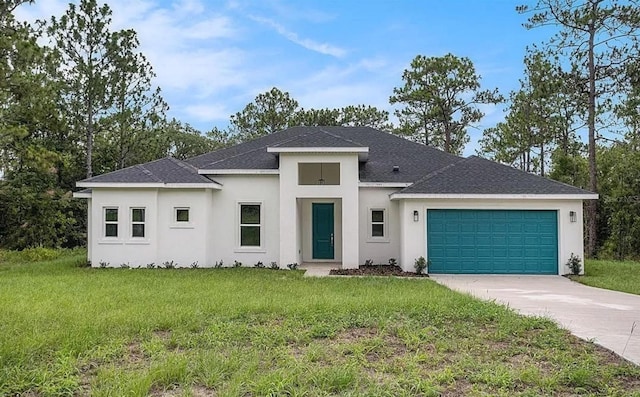 prairie-style house featuring a garage and a front yard