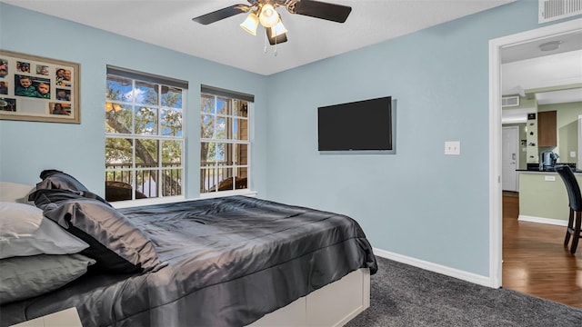 bedroom featuring ceiling fan and hardwood / wood-style flooring