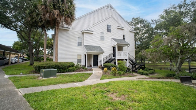 view of property with a carport and a front yard