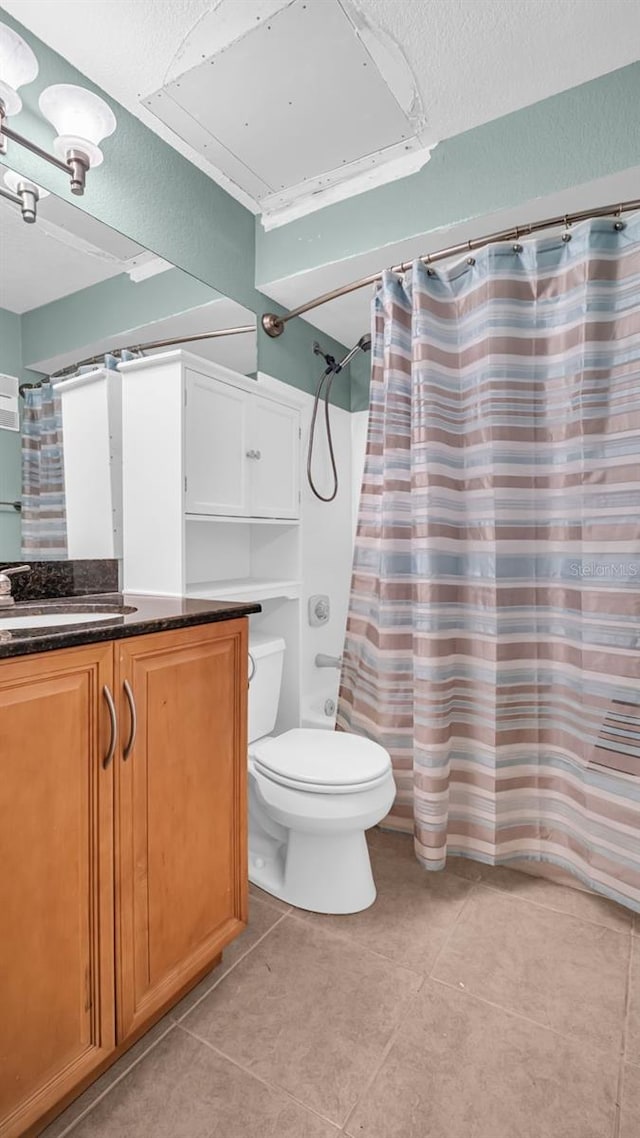 full bathroom with tile patterned flooring, shower / bath combination with curtain, toilet, and vanity