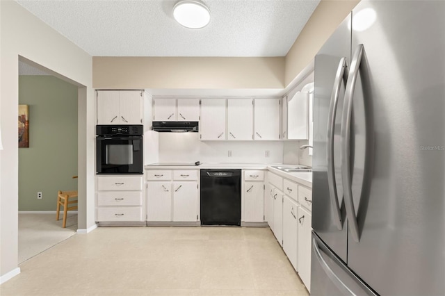 kitchen with sink, black appliances, and white cabinets