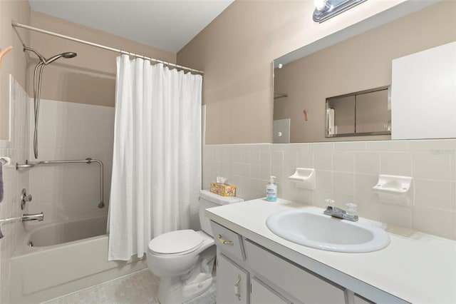 full bathroom with shower / bath combination with curtain, vanity, toilet, and tile walls