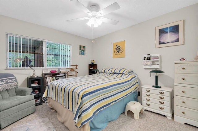 bedroom featuring ceiling fan and light colored carpet