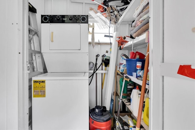 laundry room with stacked washer / drying machine