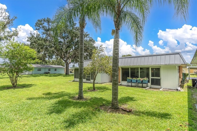 view of yard featuring a sunroom