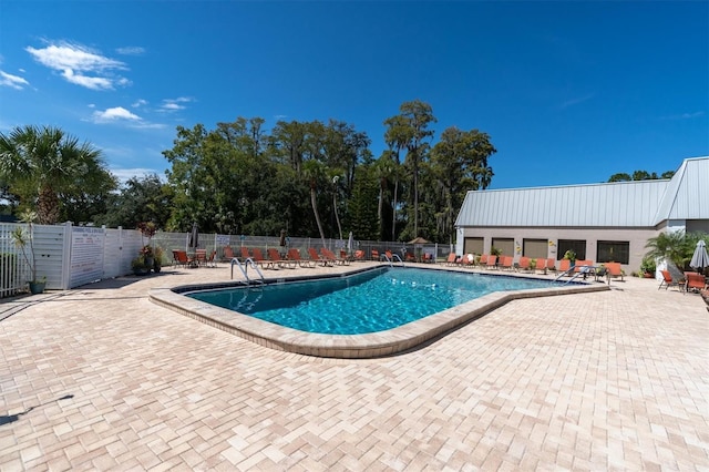 view of pool featuring a patio