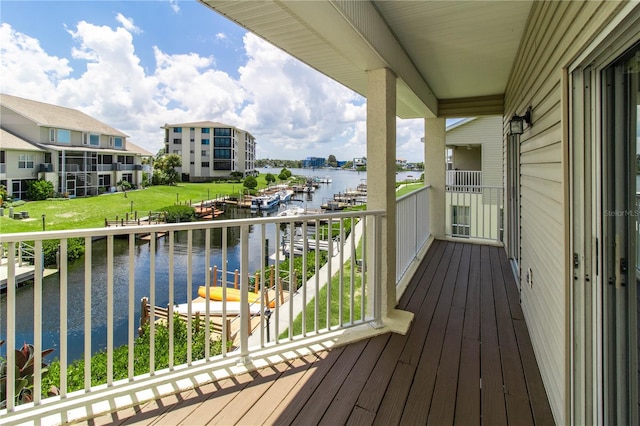 balcony featuring a boat dock and a water view