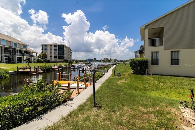 exterior space with a water view and a yard