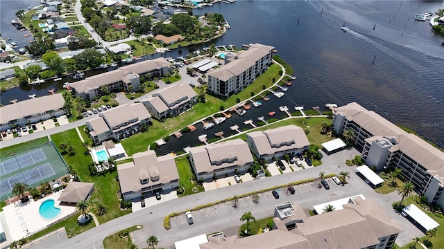 birds eye view of property with a water view