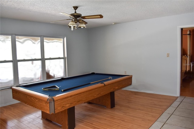 rec room with ceiling fan, pool table, tile patterned flooring, and a textured ceiling