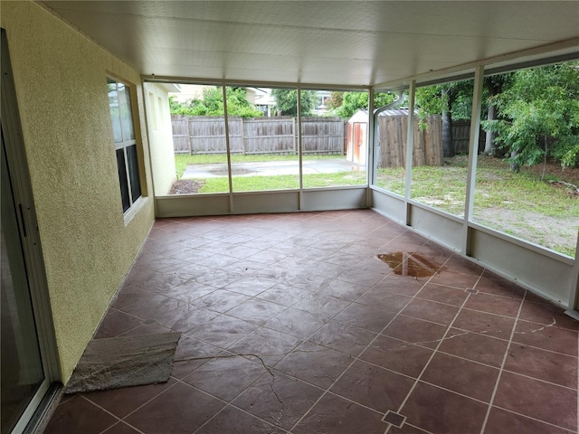 unfurnished sunroom with plenty of natural light