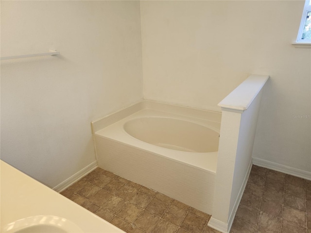 bathroom with tiled tub