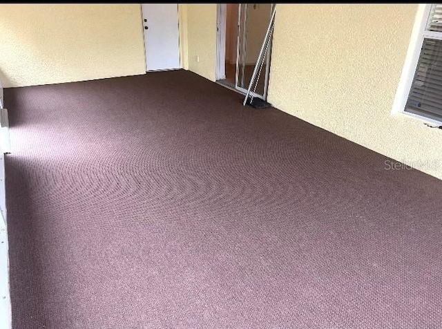 unfurnished room with carpet flooring