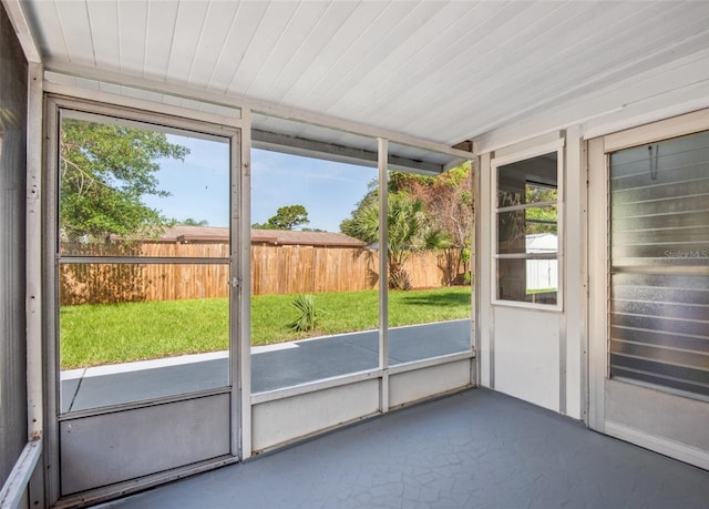 unfurnished sunroom with plenty of natural light