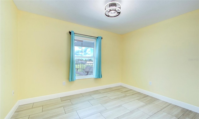 unfurnished room featuring light tile patterned floors