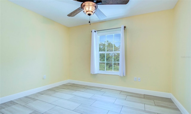 unfurnished room with light tile patterned floors and ceiling fan