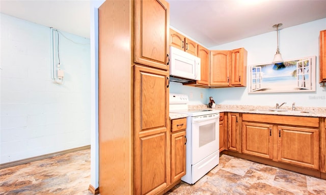 kitchen with light tile patterned flooring, pendant lighting, white appliances, sink, and light stone countertops