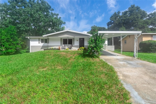 ranch-style home with a carport, driveway, a porch, and a front yard