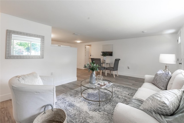 living room with light hardwood / wood-style flooring