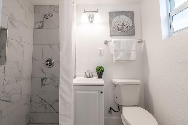 bathroom with vanity, toilet, and a shower with curtain