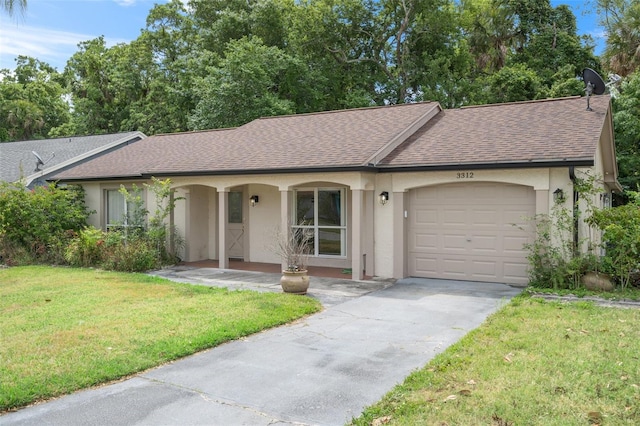 ranch-style house featuring a garage and a front lawn