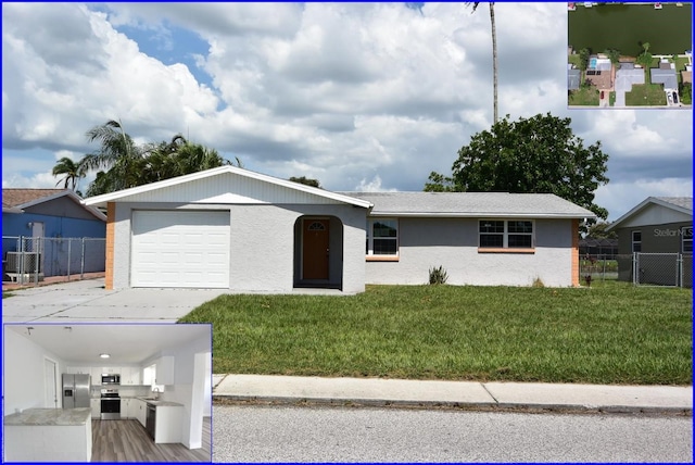 ranch-style house with a garage and a front yard