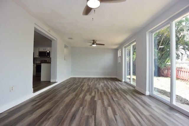 spare room with ceiling fan and hardwood / wood-style floors