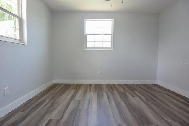 spare room with hardwood / wood-style flooring