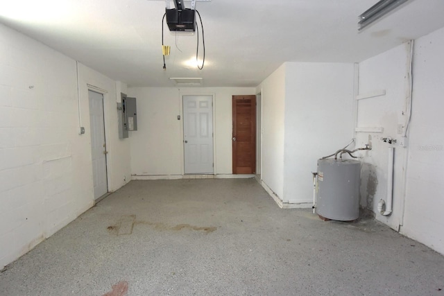 garage with water heater, a garage door opener, and electric panel