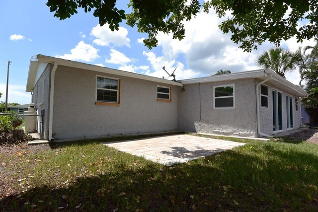 back of house featuring a patio area