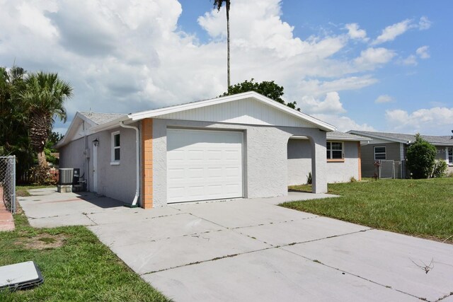 view of front of house with a garage and a front yard