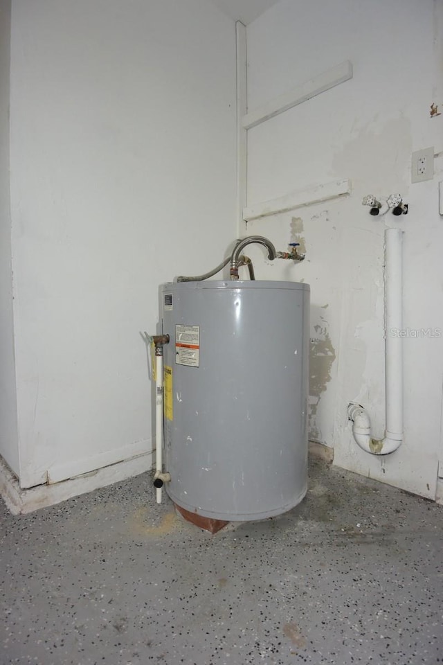 utility room with gas water heater