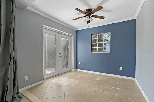 tiled spare room featuring crown molding, french doors, ceiling fan, and a healthy amount of sunlight