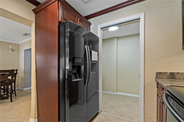 kitchen featuring stove, light tile patterned floors, crown molding, and black refrigerator with ice dispenser