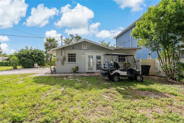 rear view of property featuring french doors