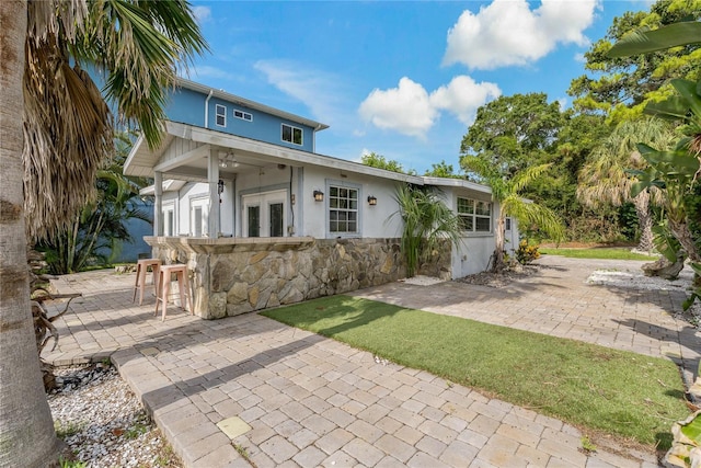 back of property featuring a patio area