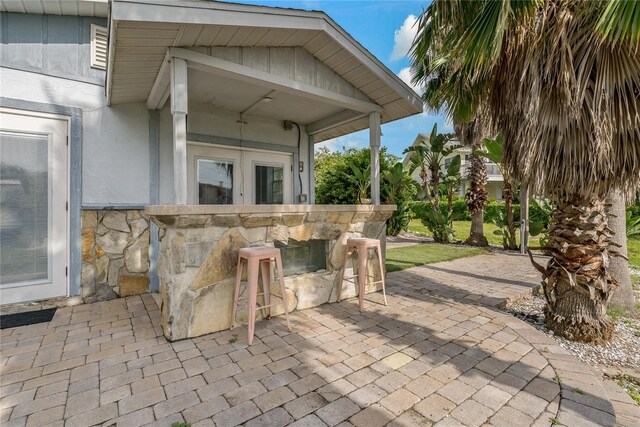 view of patio featuring exterior bar