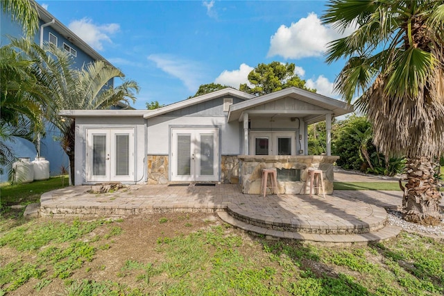 rear view of property with a patio and french doors