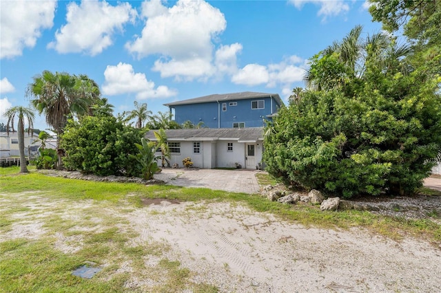 back of property with a patio